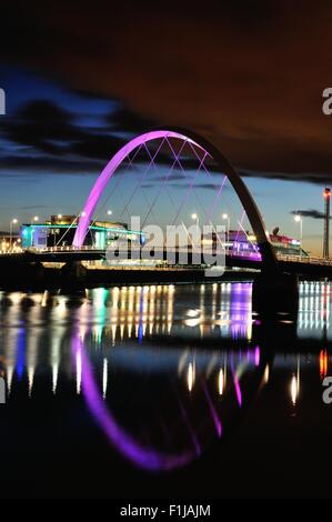 Glasgow, Scotland, UK. 02nd Sep, 2015. The Clyde Arc, also known as the Squinty Bridge, is lit up as night falls with STV and BBC offices in the background and the lights reflecting on the River Clyde Credit:  Tony Clerkson/Alamy Live News Stock Photo