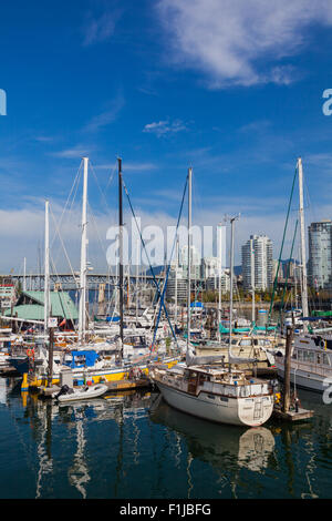 Live-aboard vessels docked at a designated marina in False Creek, Vancouver Stock Photo