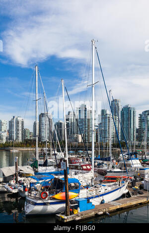 Boats docked in a marina designated for live-aboard owners in False Creek, Vancouver Stock Photo