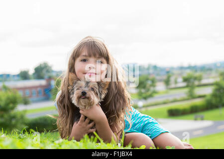 portrait of girl keeping pretty dog outdoor Stock Photo