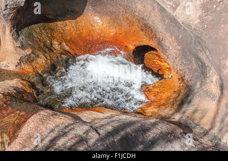 A tributary of the Gifberg River falls through a hole in the sandstone formation at the Gifberg (Poison Mountain) Resort, one of Stock Photo