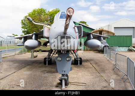 Manston Airport Museum. British GR3 Jaguar close support and nuclear strike fighter on former airport apron, now fenced off as outdoor display. Stock Photo