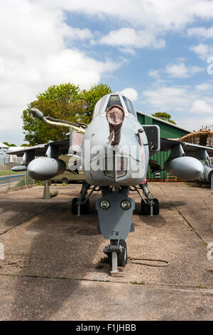 Manston Airport Museum. British GR3 Jaguar close support and nuclear strike fighter on former airport apron, now fenced off as outdoor display. Stock Photo