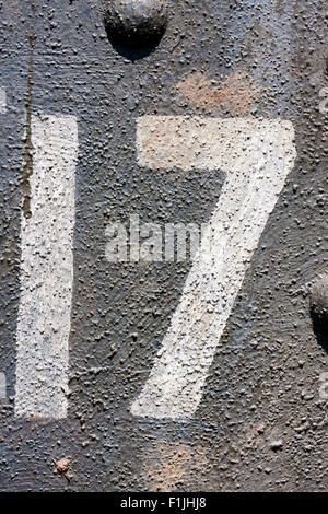 World War One re-enactment, British tank Mk IV male, detail, number 17 painted on the side. Close up of the painted number only. Stock Photo