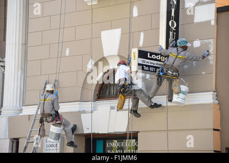 Painters renovating building facade, Long Street, Cape Town, Western Cape Province, Republic of South Africa Stock Photo