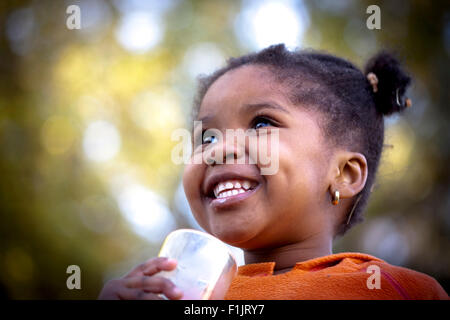 Closeup shot of young African girl, smiling Stock Photo