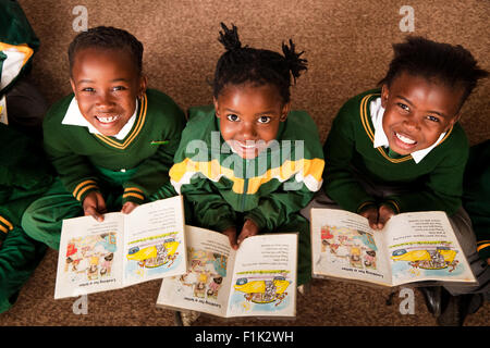 African American holding up school work proudly Stock Photo - Alamy