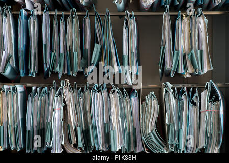 Goettingen, Germany. 27th Aug, 2015. Numerous folders concerning family legal affairs are hanging on display in a filing cabinet in an office at the local district court in Goettingen, Germany, 27 August 2015. Photo: Swen Pfoertner/dpa/Alamy Live News Stock Photo