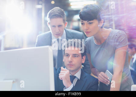Focused business people working at computer in office Stock Photo