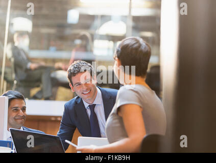 Smiling business people working in office Stock Photo