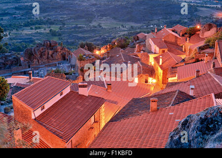 Portugal: Overlooking the rooftops of historic  mountain village Monsanto by night Stock Photo