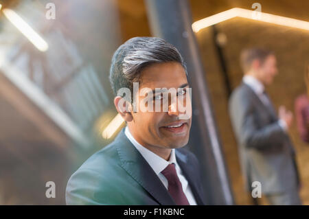 Portrait smiling businessman in office Stock Photo
