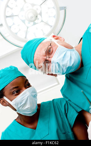 Surgeons looking down Stock Photo