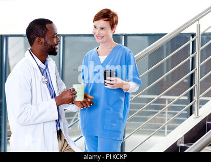A doctor and a nurse talking Stock Photo