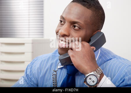 A black businessman talking on the phone Stock Photo