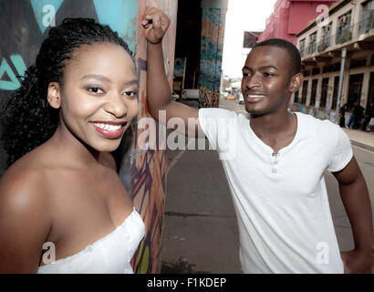 Young African couple standing under a bridge Stock Photo