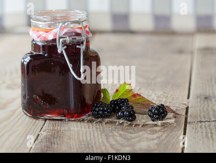 Home made blackberry Jam on a rustic wooden background Stock Photo