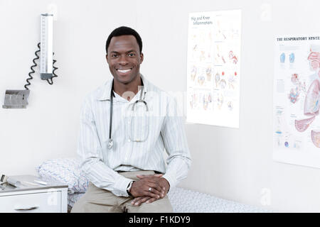 Male African doctor looking at camera, smiling Stock Photo