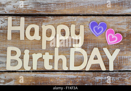 Happy birthday written with wooden letters on rustic wood Stock Photo