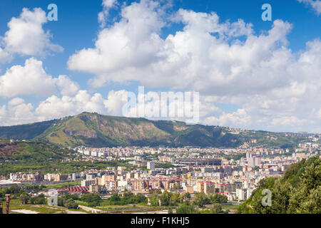 Naples cityscape with modern city part and Stadio San Paolo stadium under blue cloudy sky Stock Photo