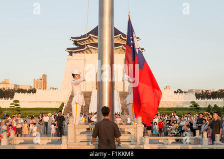 TAIPEI CITY, TAIWAN - AUGUST 2, 2015: The Honor Guard performing daily Taiwanese flag lowering ceremony in Liberty Square surrou Stock Photo