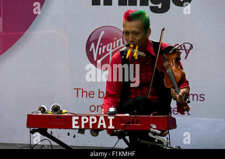 Japanese children's entertainer musician busking at the Edinburgh Festival Fringe in 2015. Stock Photo