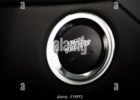 Car Engine Start Button. Black and Chrome Materials Ignite Button. Push Start Vehicle Button. Stock Photo