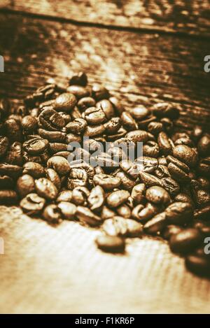 Freshly Roasted Coffee Beans Closeup Photo. Vintage Color Grading Coffee Concept. Stock Photo