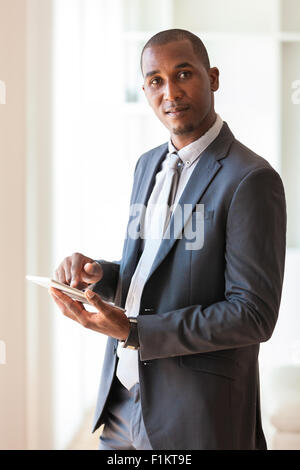 African american business man using a tactile tablet  - Black people Stock Photo