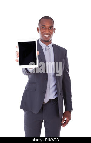 African american business man using a tactile tablet over white background - Black people Stock Photo