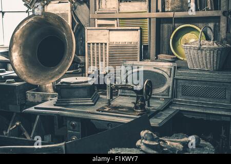 Antique Store Inventory. Old Gramophone, Sewing Machine and Other Early Twenty Century Stuff. Stock Photo