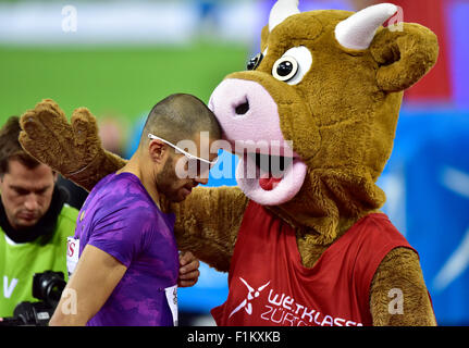 Zurich, Switzerland. 03rd Sep, 2015. Meeting mascot Cooly hugs Swiss local idol Kariem Hussein (SUI) after he won the 400m hurdles race at the 2015 Zurich IAAF Diamond League athletics meeting. Credit:  Erik Tham/Alamy Live News Stock Photo