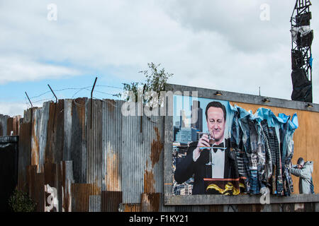 Street artist Banksy's Dismaland in Weston-Super-Mare. Pictured is piece featuring Prime Minister David Cameron on a billboard. Stock Photo