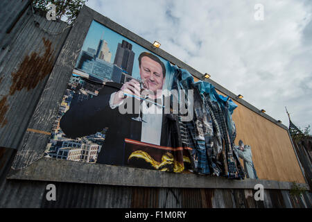 Street artist Banksy's Dismaland in Weston-Super-Mare. Pictured is piece featuring Prime Minister David Cameron on a billboard. Stock Photo