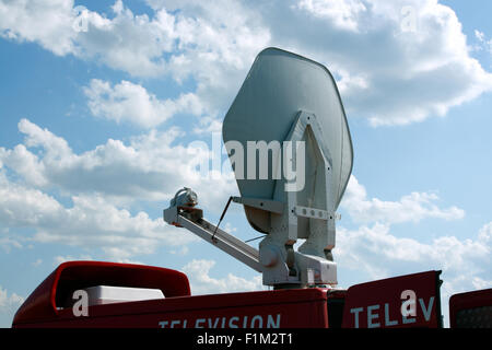 Television vehicle with parabolic antenna on the roof Stock Photo