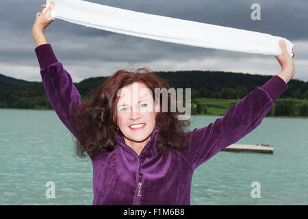 Attractive young woman outdoors at a lake Stock Photo