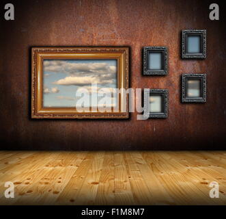 abstract architectural interior backdrop with frames on rusty wall and wooden floor Stock Photo