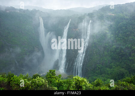 The beautiful and scenic Jog Falls created by the Sharavathi River on a foggy morning in monsoon season. Stock Photo