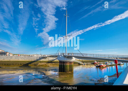 Pont y Ddraig or the Red Dragon bridge is the iconic bascule bridge at Rhyl Harbour opened in autumn 2013. Stock Photo