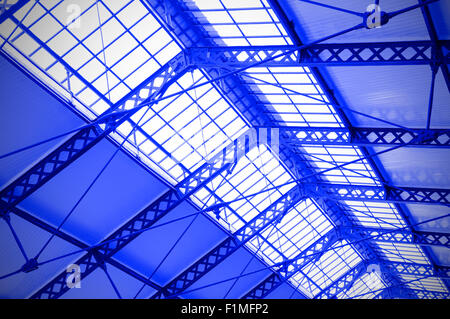 Industrial ceiling of a railway station toned in the blue color Stock Photo