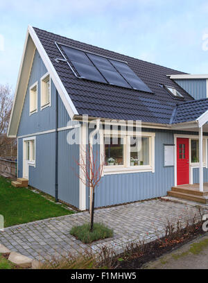 Typical swedish detached middle class wooden house with modern roof solar panels in Floda, Sweden  Model Release: No.  Property release: No. Stock Photo