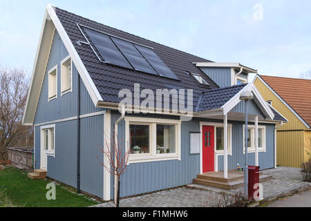 Typical swedish detached middle class wooden house with modern roof solar panels in Floda, Sweden  Model Release: No.  Property release: No. Stock Photo
