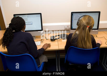 Primary school pupil's learning IT skills, London, UK. Stock Photo