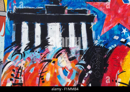 Brandengurg gate in the mural 'US Flagge' by Peter Lorenz on the East Side Gallery on August 8, 2015 in Berlin, Germany. Stock Photo