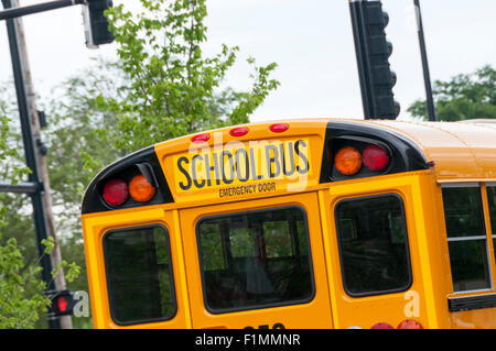 The back of a yellow American school bus. Stock Photo