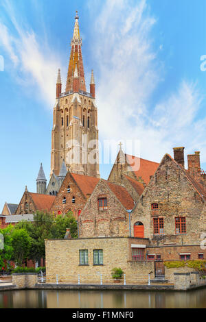 Bruges canal with Church of Our Lady on background Stock Photo