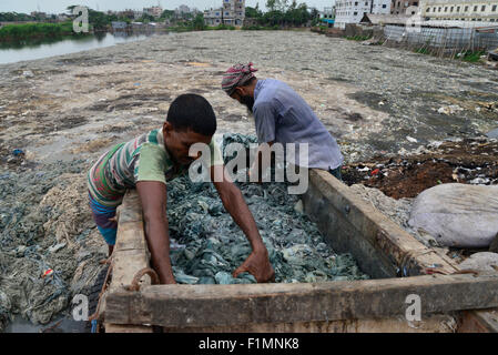 Bangladeshi day labors works in toxic polluted environment in the leather industry area at Hazaribag in Dhaka city, Bangladesh. Stock Photo