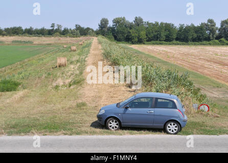 Car parked on the side of a backroad, Italy Stock Photo