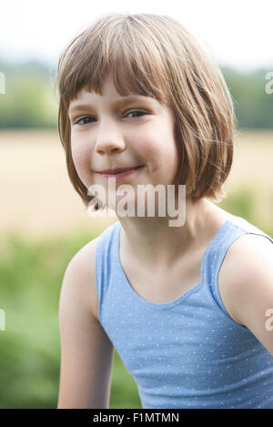 Outdoor Head And Shoulders Portrait Of Girl Stock Photo