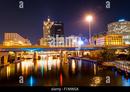 Milwaukee River, downtown buildings and busy interstate highway at night Stock Photo